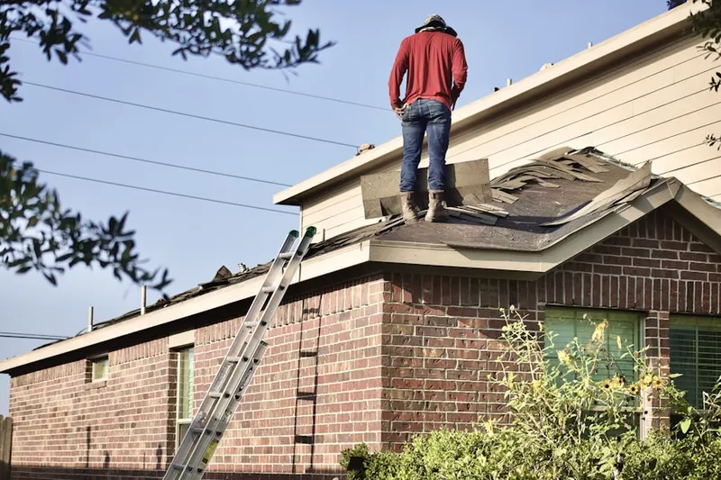 Professional roofer working on a residential roof in Everharts Crossroads
